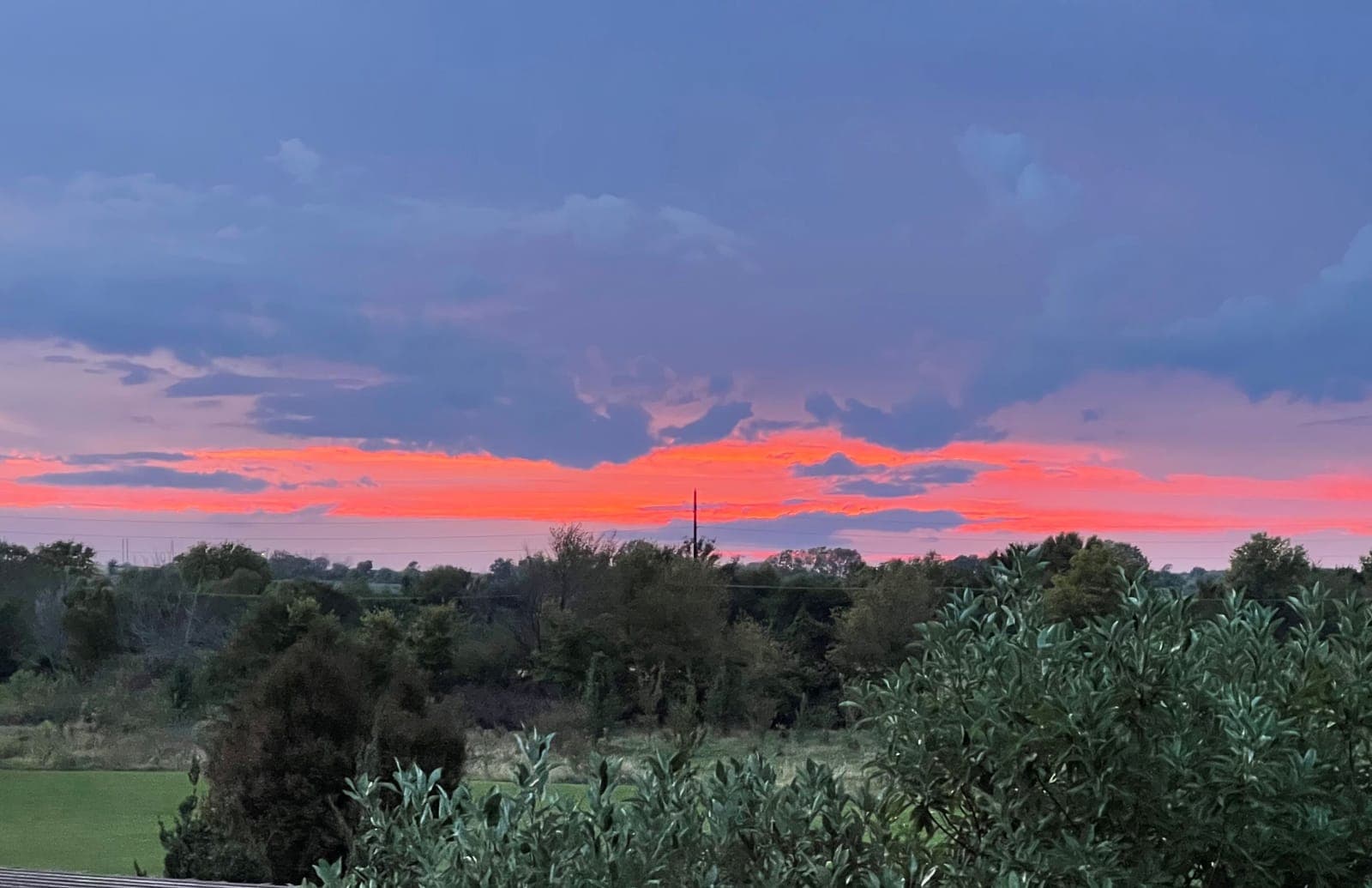 Golden-hour light across the open Kansas prairie at Sunset Farm Estates